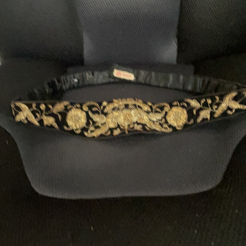 Vintage from the 1940’s black Waist band with 5 hooks to adjust size. Length 31”